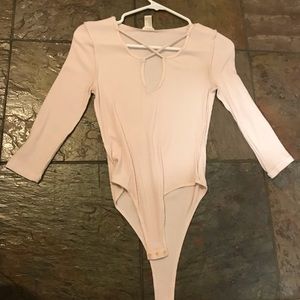 Light pink body suit